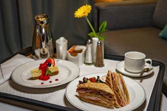 Fred. Olsen Cruise Line Room Service Traditional Turkey Bacon Club Sandwich and New York Cheesecake.jpg